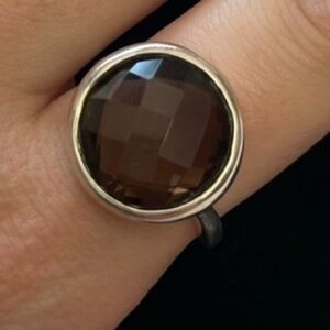 Sterling silver ring with round brown stone
Size 9